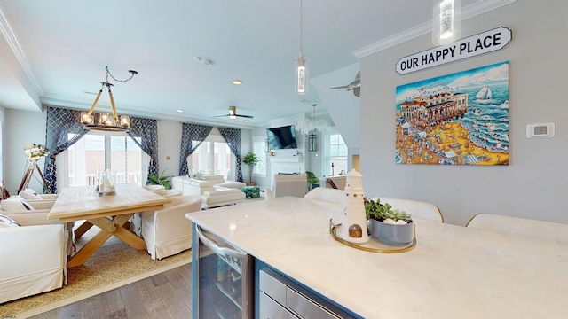 305 15th St, Ocean City, NJ 08226 - kitchen featuring crown molding, open floor plan, beverage cooler, wood finished floors, and healthy amount of natural light