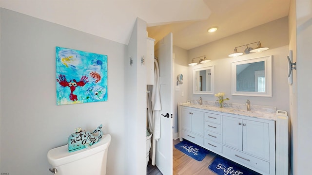 305 15th St, Ocean City, NJ 08226 - bathroom featuring toilet, double vanity, recessed lighting, and wood finished floors