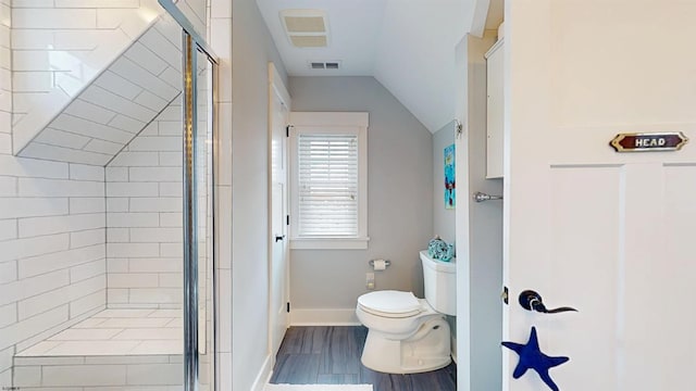 305 15th St, Ocean City, NJ 08226 - bathroom featuring toilet, a stall shower, lofted ceiling, wood finished floors, and baseboards
