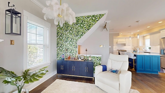 305 15th St, Ocean City, NJ 08226 - living area featuring dark wood-type flooring, crown molding, recessed lighting, baseboards, and a chandelier