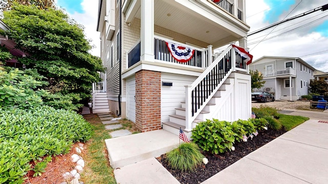 305 15th St, Ocean City, NJ 08226 - view of exterior entry featuring brick siding and a porch