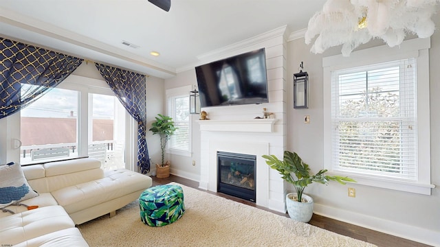 305 15th St, Ocean City, NJ 08226 - living room with baseboards, wood finished floors, crown molding, a glass covered fireplace, and recessed lighting