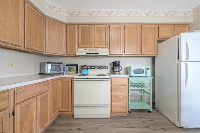 510 Lafayette Blvd, Brigantine, NJ 08203 - kitchen featuring white appliances, under cabinet range hood, light countertops, light wood-style flooring, and light brown cabinetry