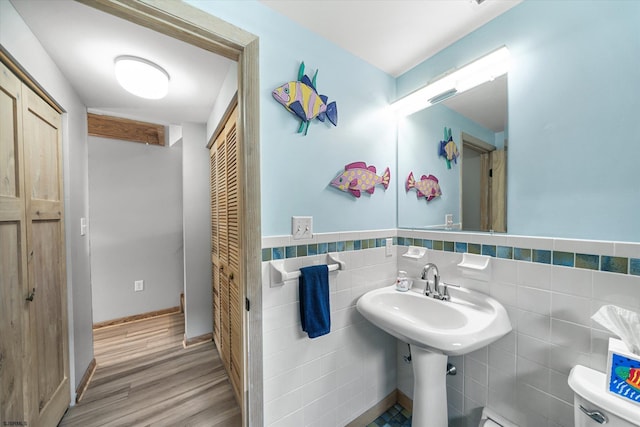36 S Inlet Dr Unit 2, Ocean City, NJ 08226 - bathroom featuring toilet, wood finished floors, tile walls, and a wainscoted wall