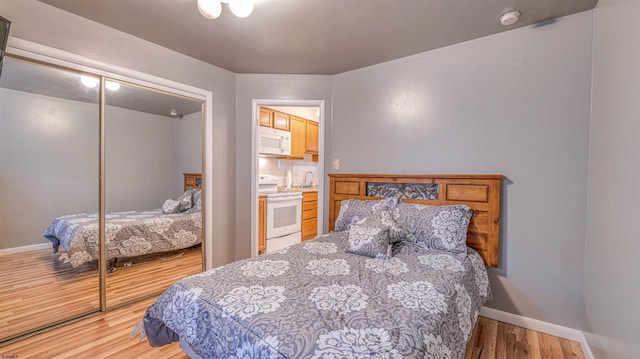 9600 Amherst Ave Unit 3, Margate, NJ 08402 - bedroom with wood finished floors, a closet, and baseboards