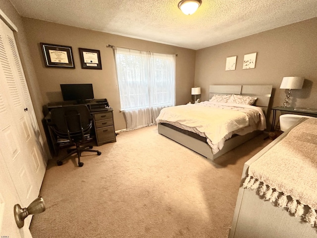 160 Rumson Dr Unit 1053, Galloway Township, NJ 08205 - bedroom featuring an office area, a textured ceiling, a closet, and carpet