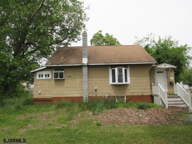 1412 W Cleveland Ave, Egg Harbor City, NJ 08215 - rear view of house featuring a chimney