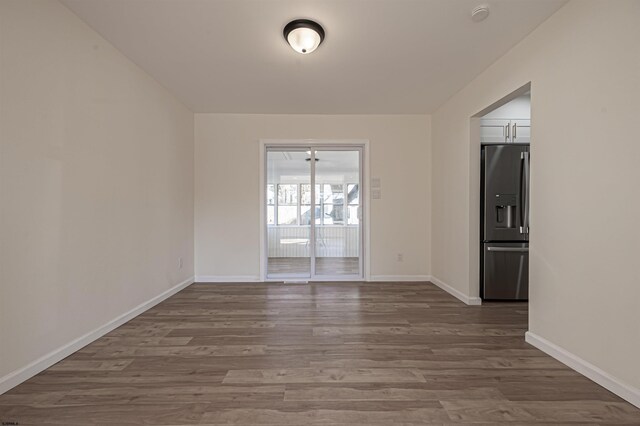 110 Seaside Ave, Egg Harbor Township, NJ 08234 - spare room with wood finished floors, a smoke detector, and baseboards