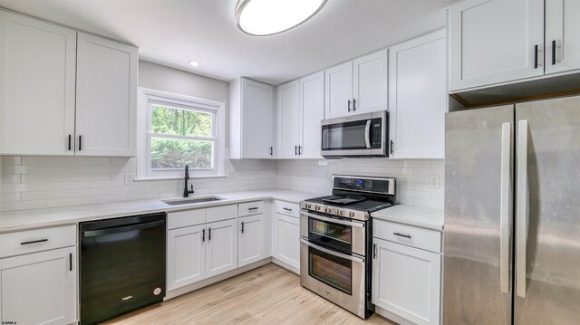 11 Carann Ln, Egg Harbor Township, NJ 08234 - kitchen featuring appliances with stainless steel finishes, a sink, light countertops, and white cabinets