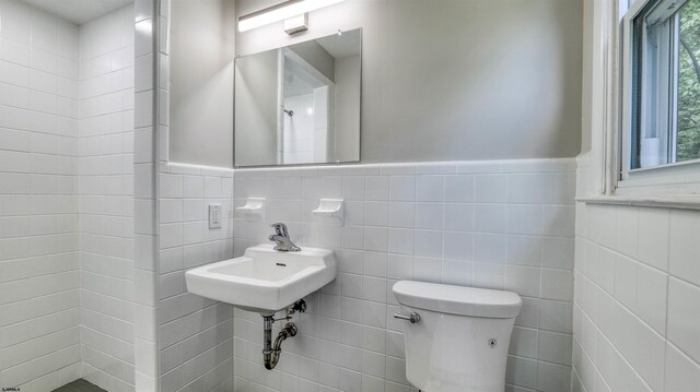 11 Carann Ln, Egg Harbor Township, NJ 08234 - bathroom with toilet, a wainscoted wall, tile walls, and a sink