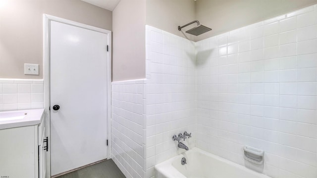 11 Carann Ln, Egg Harbor Township, NJ 08234 - full bathroom featuring shower / tub combination, tile walls, vanity, and a wainscoted wall