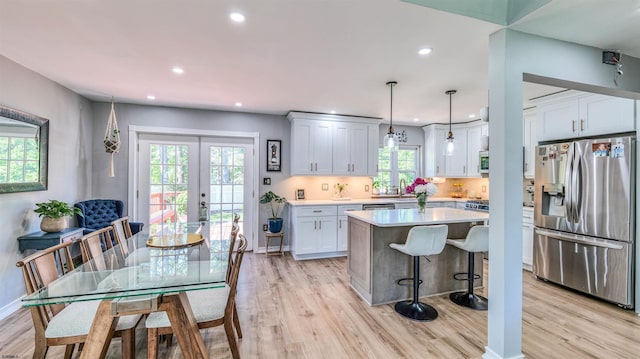 521 Saratoga Pl, Smithville, NJ 08234 - kitchen with stainless steel appliances, light wood-style floors, light countertops, french doors, and recessed lighting