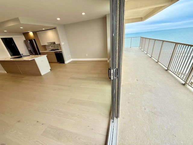 5000 Boardwalk Unit 1617, Ventnor, NJ 08406 - kitchen featuring baseboards, freestanding refrigerator, recessed lighting, light countertops, and a water view