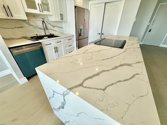 5000 Boardwalk Unit 1617-1616, Ventnor, NJ 08406 - kitchen featuring dishwasher, stainless steel fridge with ice dispenser, light stone countertops, and white cabinets