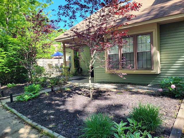 709 E Cooper Ferry Ct Unit 709, Galloway Township, NJ 08205 - view of side of property featuring roof with shingles