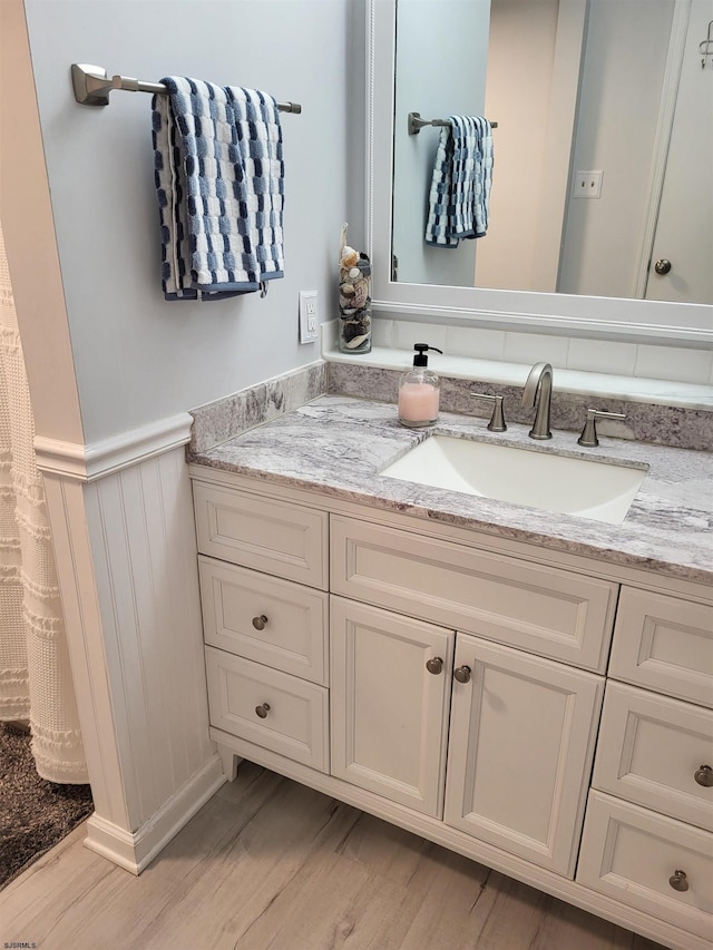 709 E Cooper Ferry Ct Unit 709, Galloway Township, NJ 08205 - bathroom with vanity, wainscoting, and wood finished floors