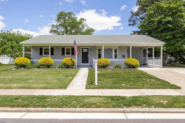 9 Rutgers Rd, Somers Point, NJ 08244 - view of front of house with covered porch, concrete driveway, a front lawn, and an attached carport