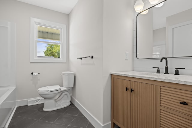 9 Rutgers Rd, Somers Point, NJ 08244 - full bathroom with baseboards, toilet, vanity, and tile patterned floors