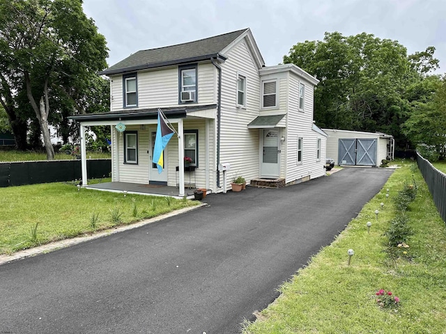 311 N 7th St, Millville, NJ 08332 - view of front of house with an outdoor structure, a porch, a garage, and a shingled roof