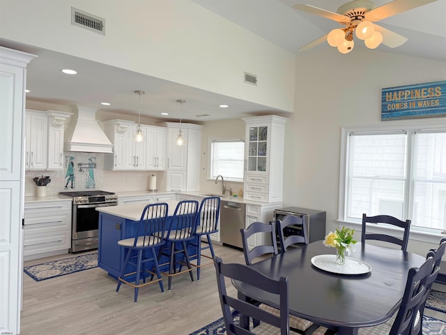 305 Battersea Rd Unit 2, Ocean City, NJ 08226 - dining room with light wood-style floors, ceiling fan, recessed lighting, and high vaulted ceiling