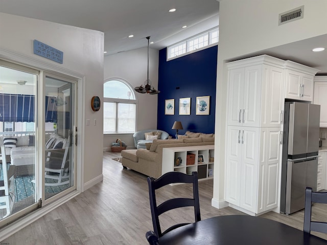 305 Battersea Rd Unit 2, Ocean City, NJ 08226 - dining room with light wood-style flooring, baseboards, recessed lighting, and a towering ceiling