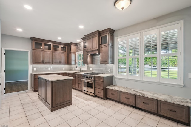 515 Bella Ct, Galloway Township, NJ 08205 - kitchen with high end range, tasteful backsplash, a sink, a center island, and glass insert cabinets