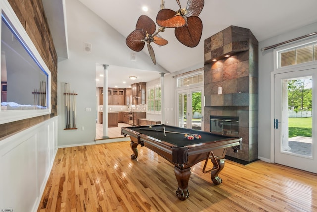 515 Bella Ct, Galloway Township, NJ 08205 - playroom with billiards table, lofted ceiling, light wood finished floors, a tiled fireplace, and healthy amount of natural light