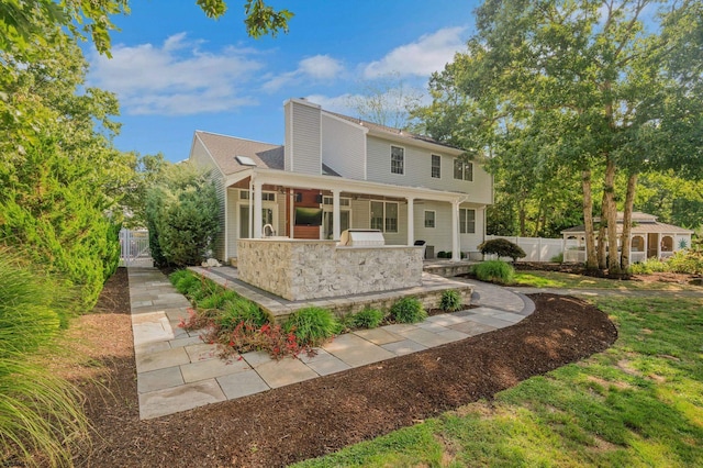 515 Bella Ct, Galloway Township, NJ 08205 - view of front facade featuring a chimney and a gate