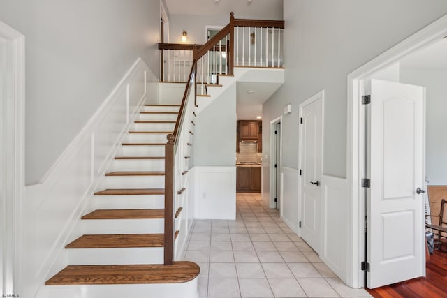 515 Bella Ct, Galloway Township, NJ 08205 - staircase with tile patterned floors and a towering ceiling