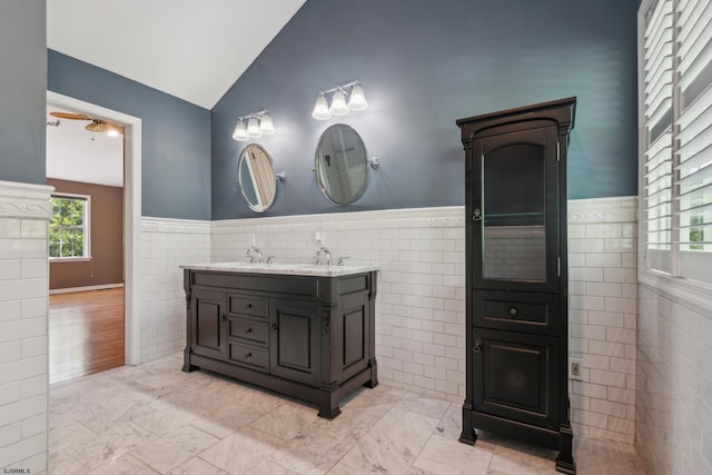 515 Bella Ct, Galloway Township, NJ 08205 - full bath featuring tile walls, vaulted ceiling, double vanity, a wainscoted wall, and marble finish floors