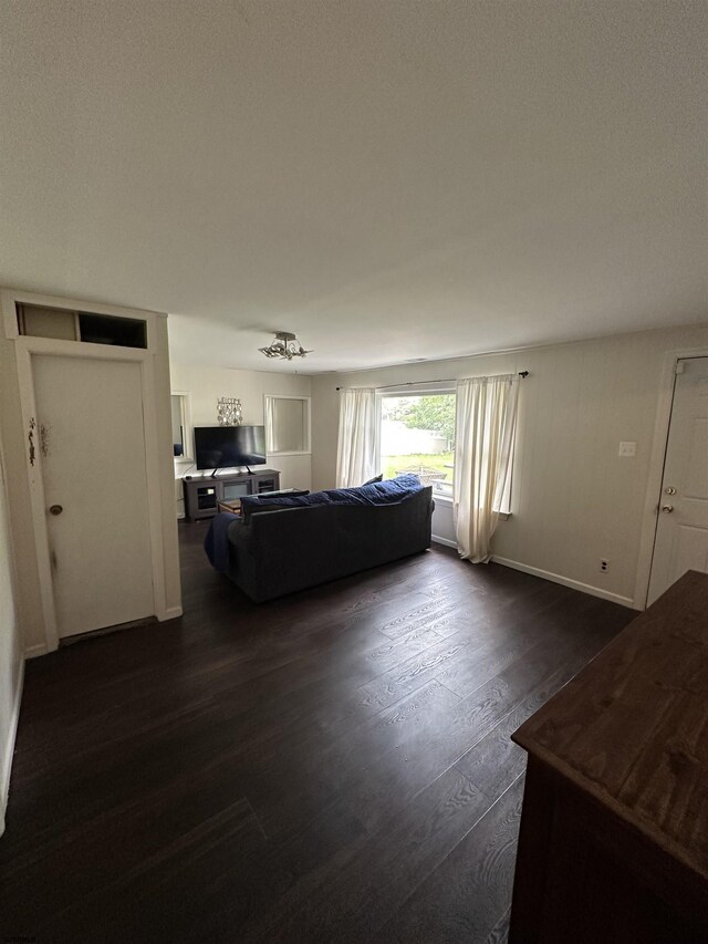 1634 S Bowling Green Dr, Cherry Hill, NJ 08003 - living room with dark wood-type flooring and baseboards