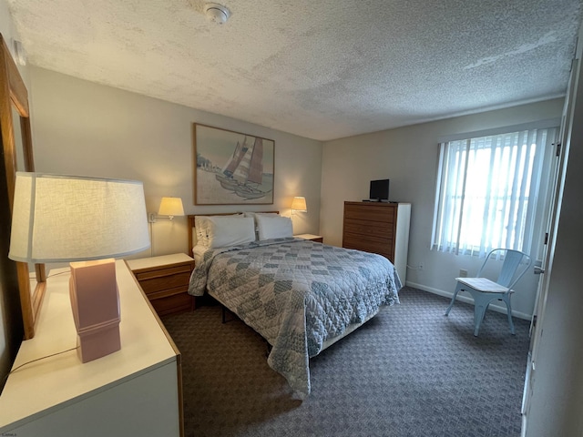 853-71 Plymouth Pl Unit 13, Ocean City, NJ 08226 - bedroom featuring dark colored carpet, a textured ceiling, and baseboards