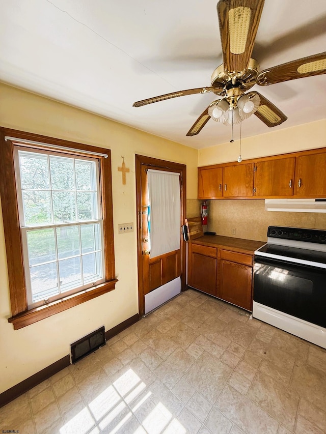 4 E Finley Rd, Upper Deerfield Township, NJ 08302 - kitchen with range with electric cooktop, extractor fan, brown cabinetry, baseboards, and ceiling fan