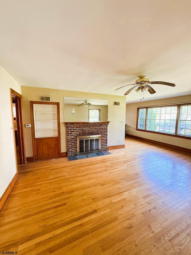 4 E Finley Rd, Upper Deerfield Township, NJ 08302 - unfurnished living room featuring light wood-style floors, ceiling fan, baseboards, and a fireplace