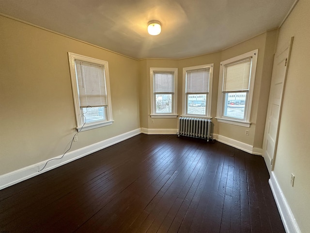 220 Seaside Ave, Atlantic City, NJ 08401 - spare room featuring radiator heating unit, dark wood-style flooring, and baseboards