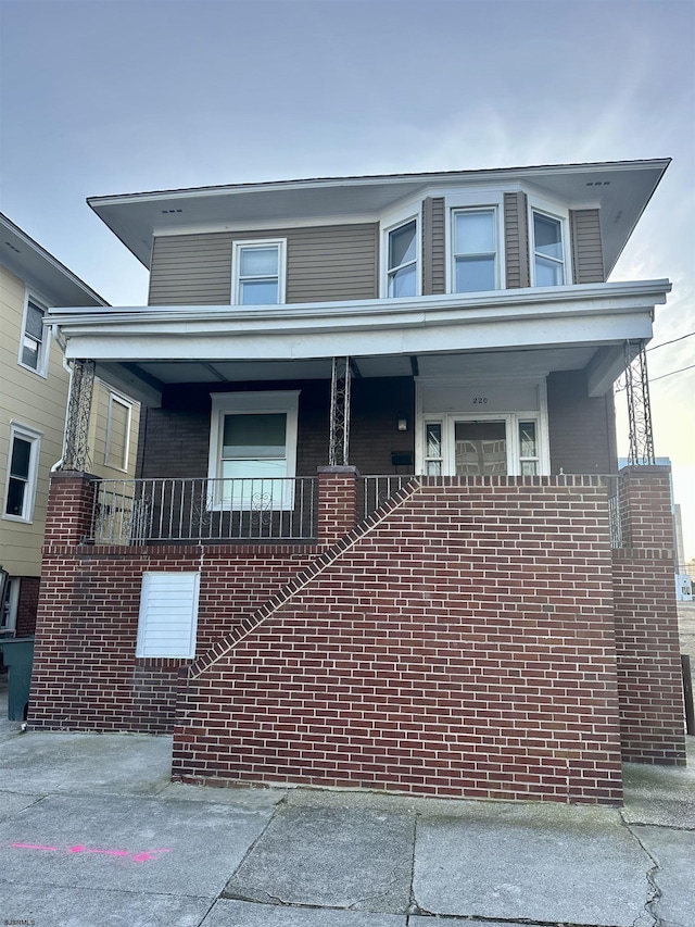 220 Seaside Ave, Atlantic City, NJ 08401 - view of front of house featuring brick siding and a porch