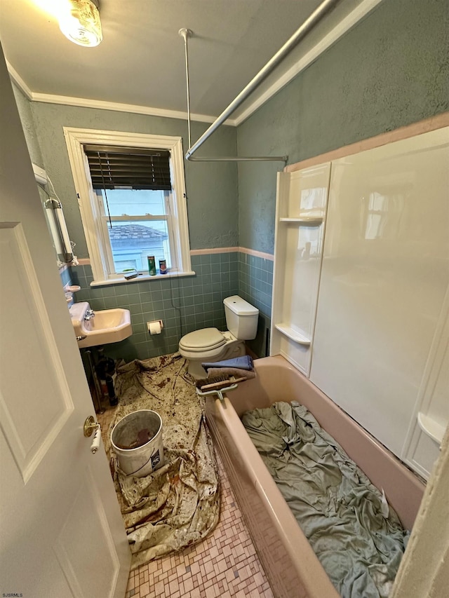 220 Seaside Ave, Atlantic City, NJ 08401 - bathroom with tile walls, toilet, a wainscoted wall, shower / bath combination, and a sink
