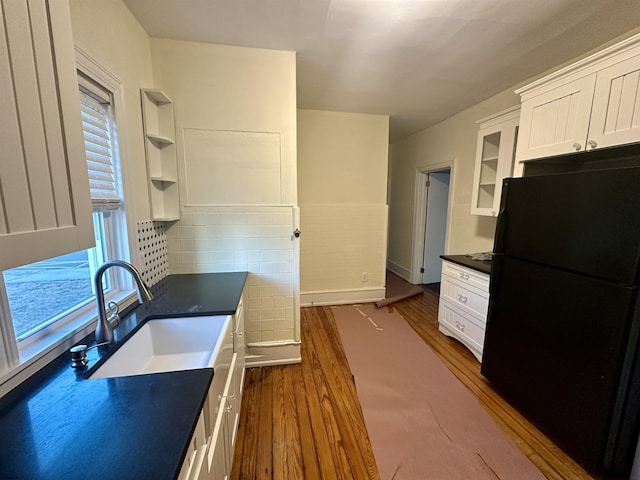 220 Seaside Ave, Atlantic City, NJ 08401 - kitchen with freestanding refrigerator, dark wood-type flooring, white cabinetry, and dark countertops