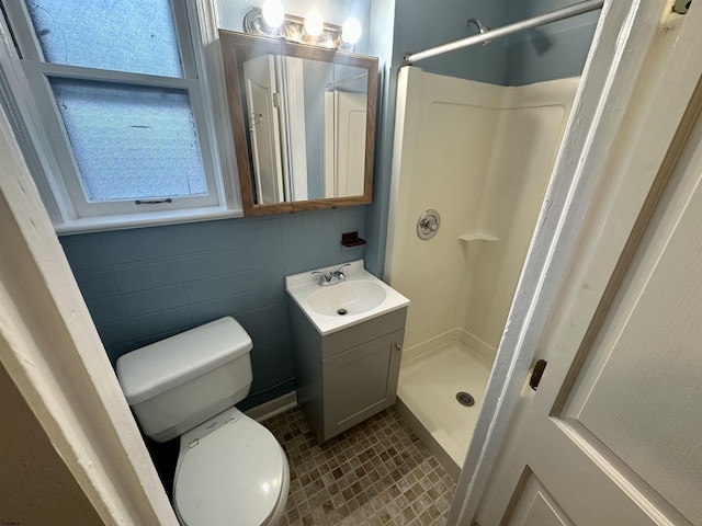 220 Seaside Ave, Atlantic City, NJ 08401 - bathroom with vanity, a stall shower, toilet, and tile walls