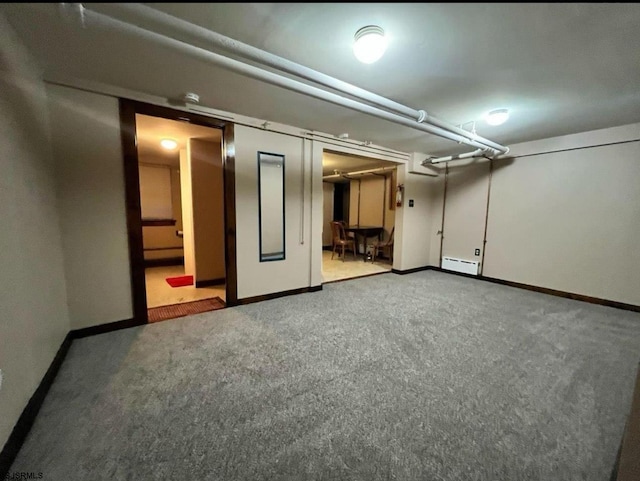 220 Seaside Ave, Atlantic City, NJ 08401 - finished basement featuring a baseboard radiator, carpet, and baseboards