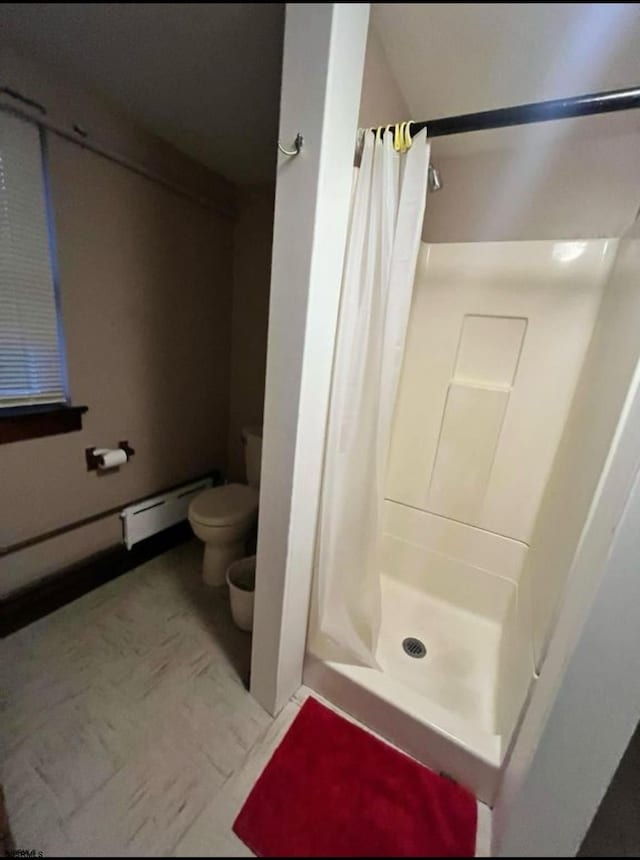 220 Seaside Ave, Atlantic City, NJ 08401 - bathroom featuring a shower stall, toilet, and a baseboard radiator