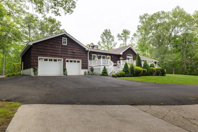 71 Zion Rd, Egg Harbor Township, NJ 08234 - view of front facade featuring driveway, a porch, a front yard, a garage, and a chimney