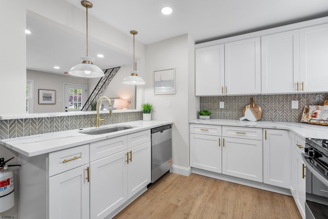 118 Colwick Dr, Somers Point, NJ 08244 - kitchen featuring dishwasher, a sink, tasteful backsplash, white cabinetry, and light wood finished floors
