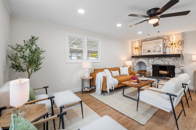 118 Colwick Dr, Somers Point, NJ 08244 - living area with ornamental molding, ceiling fan, light wood-style flooring, baseboards, and a stone fireplace