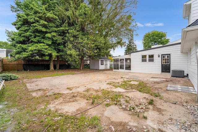 118 Colwick Dr, Somers Point, NJ 08244 - view of yard featuring a sunroom, a patio area, and central AC