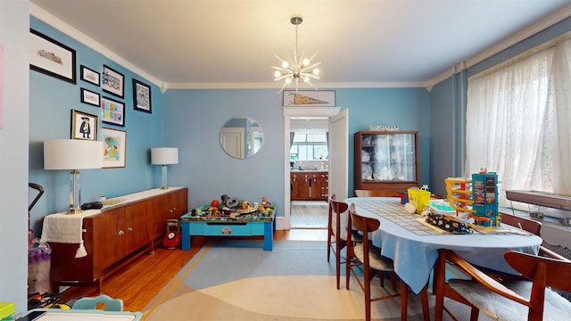27 School St, Absecon, NJ 08201 - dining area with a chandelier, wood finished floors, and ornamental molding
