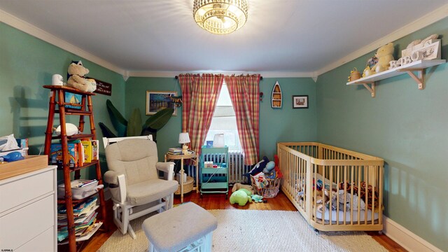 27 School St, Absecon, NJ 08201 - bedroom featuring ornamental molding and wood finished floors
