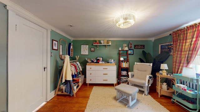 27 School St, Absecon, NJ 08201 - bedroom featuring ornamental molding, wood finished floors, and a chandelier