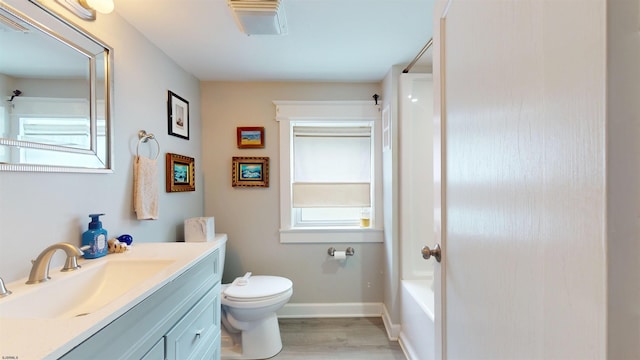 27 School St, Absecon, NJ 08201 - full bathroom with vanity, wood finished floors, toilet, baseboards, and shower / bath combination