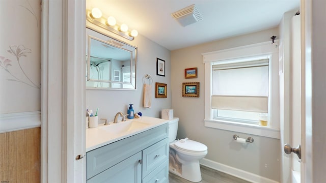 27 School St, Absecon, NJ 08201 - bathroom with vanity, toilet, plenty of natural light, and baseboards